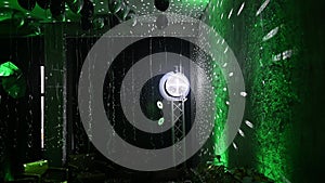 The disco ball mirror spins and reflects the light at the disco in the club.
