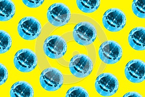 Disco ball pattern on a yellow background. Bright creative colors. Concept of music, holiday and party. Disco club and night life