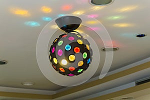 Lighted disco ball on a celling
