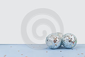 Disco ball on white and light blue background