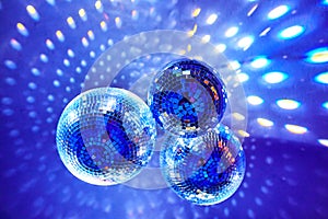 Disco balls with colorful bright rays , night party background photo