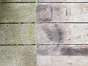 Discolored or worn or weathered wood deck boards with algae