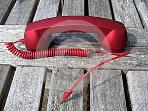 Disconnected red phone receiver photo
