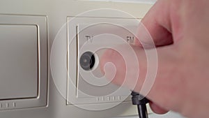 Disconnecting radio antenna plug from broadcasting network home outlet