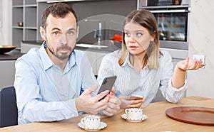 Discontented couple with phones