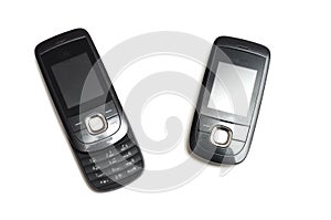 A discontinued 2G slide mobile phone in closed and opened call positions