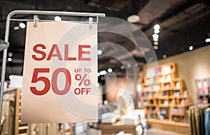 Discount percentage sign display in  fashion department store during sale season period