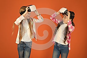 Discover virtual reality. Kids girls play virtual reality game. Friends interact in vr. Explore alternative reality