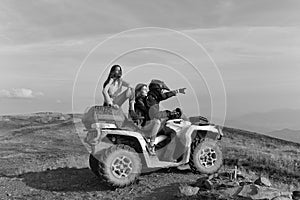 Discoverers. Man and girls ride quad