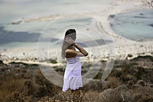 The woman dressed in white over the Balos lagoon photo