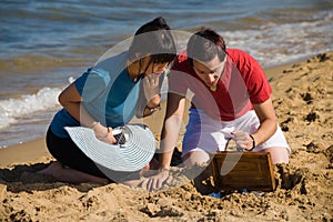 Discovering a treasure on the sand photo