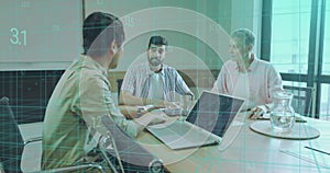 Discussing data overlays, three professionals analyzing reports at meeting table with laptops