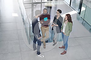 Discussing solutions for the problem at hand. a group of businesspeople having a discussion in an office.