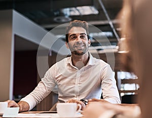 Discussing their best ways to succeed big. a young businessman having a meeting with a colleague in an office.