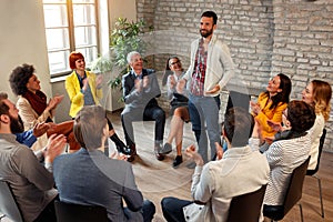 Discussion business group- coworkers applauding man colleagues i