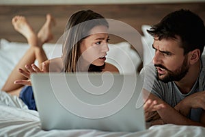 Discussion couple in the bed Modern lifestyle concept