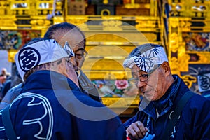 Discussion among elders before Japanese festival (matsuri)