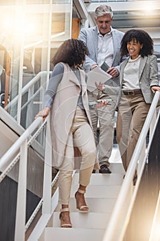 Discussion, office and business people on stairs walking to meeting for planning, strategy and chatting at work