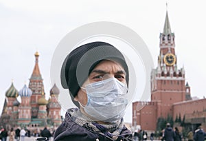 Disease outbreak, coronavirus covid-19 pandemic, air pollution in Moscow, Russia. Portrait of adult man with medical protective ma