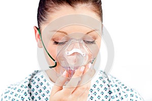 Diseased caucasian woman wearing an oxygen mask