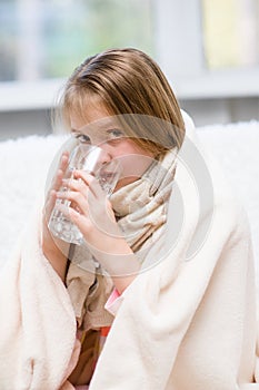 Diseased girl drinks water
