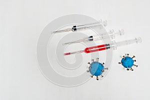 Diseased and recovery concept, the syringes with empty and red liquid and simulated virus