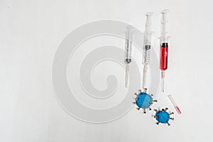 Diseased and recovery concept, the syringes with empty and red liquid and simulated virus placed