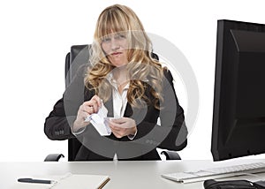 Disgusted businesswoman ripping up paper