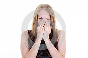 Disgusted scared woman with hands on surprised face on white background