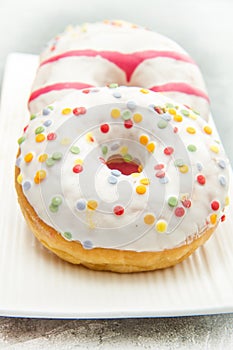 Dish with assorted donuts, coffee and juice