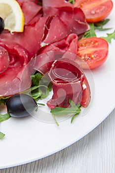 Dish of bresaola and aragula