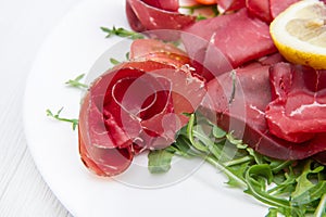 Dish of bresaola and aragula