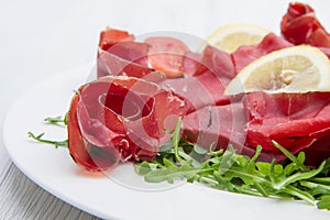 Dish of bresaola and aragula