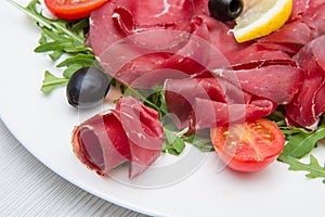 Dish of bresaola and aragula