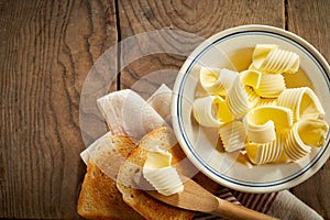 Dish of butter curls with crispy golden toast