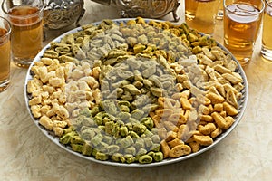 Dish with colorful miniature shortbread cookies, called Krichlate close up