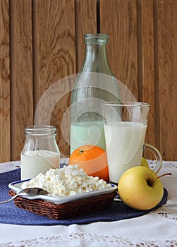 Dish of cottage cheese, a bottle of milk