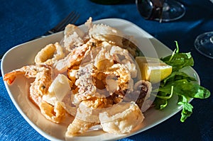 Dish of crispy fried squid and shrimps in Italy photo