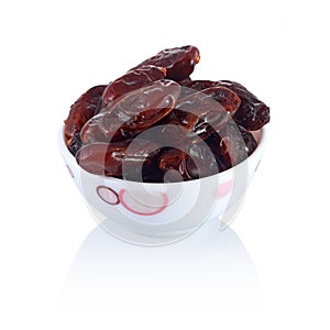 A dish of dates isolated