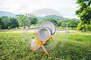 Dish drainer on green grass, forest and mountain view