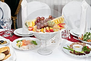 Dish with fresh fruit on the Banquet table in the restaurant