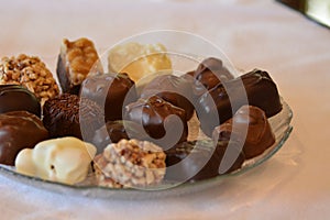 Dish full of luscious assorted chocolates photo