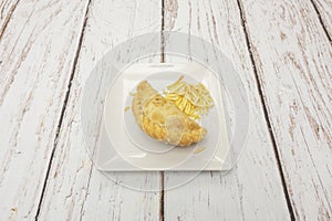 A dish of goat cheese and caramelized onion empanadas, where the cheese melts and blends with the sweet onion