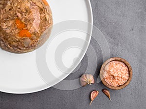 Dish good for joins, Jelly with meat, beef aspic, traditional Russian dish, portion on a plate, mustard