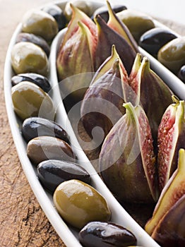 Dish of Green and Black Olives with Fresh Figs