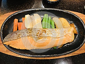 Dish of Grilled rainbow trout fillet steak.