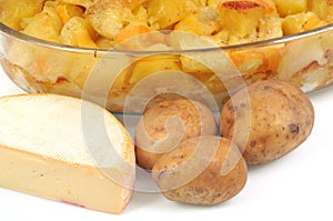 Dish of homemade tartiflette and its ingredients close-up