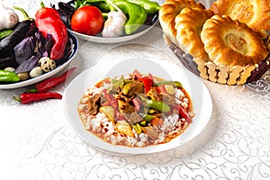 Dish with meat, rice and vegetables. Traditional oriental dish.