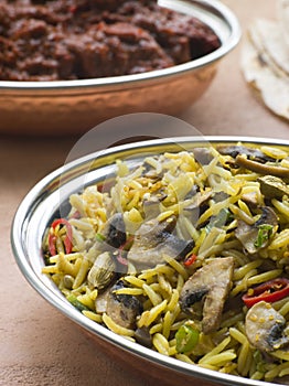 Dish of Mushroom Pilau Rice with Beef Madras photo