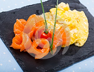 Dish of Norwegian cuisine of cooked omlette fried and served with salmon